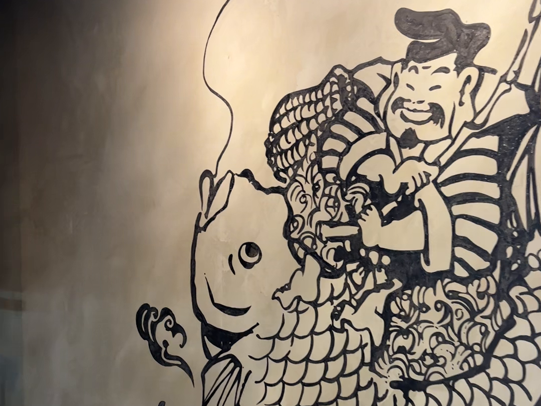 えびすの絵が描かれた店内の壁